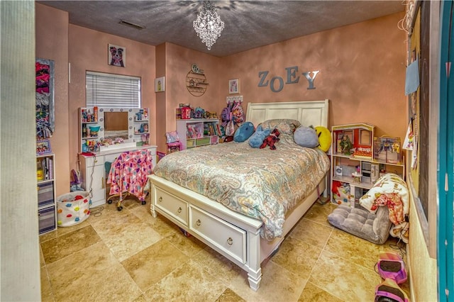 bedroom with a chandelier