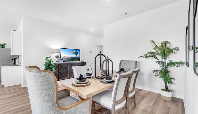 dining room with light hardwood / wood-style flooring