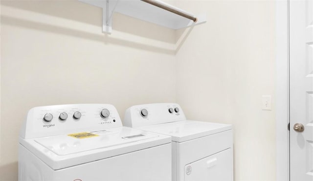 laundry room featuring washer and clothes dryer