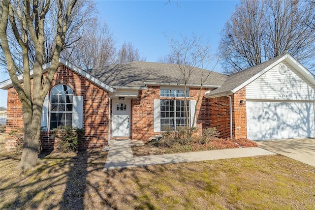 single story home with a garage and a front lawn