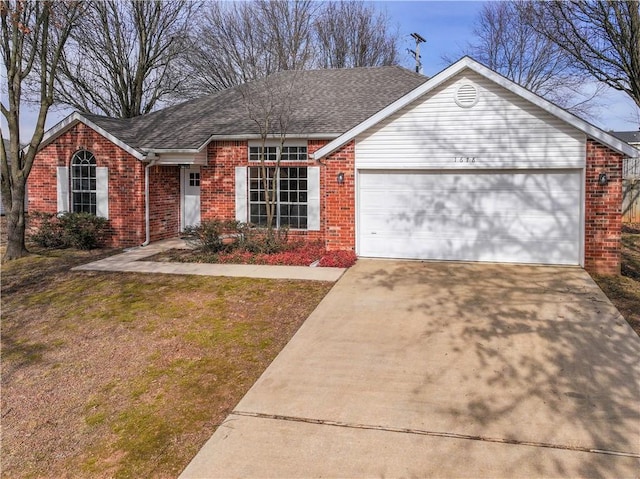 ranch-style house with brick siding, a garage, driveway, and roof with shingles