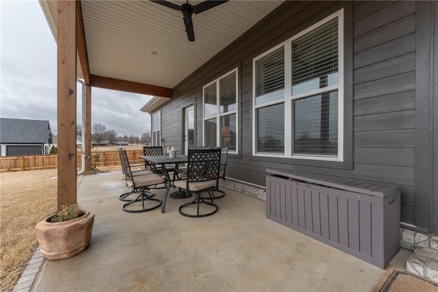 view of patio featuring ceiling fan and radiator