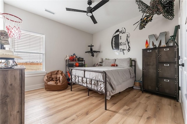 bedroom featuring ceiling fan and light wood-type flooring