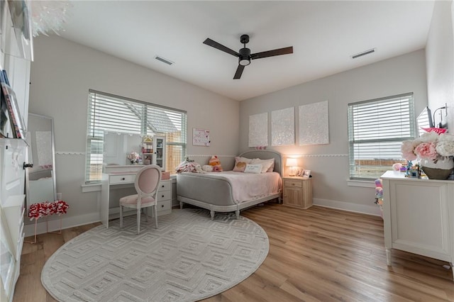 bedroom with ceiling fan and light wood-type flooring