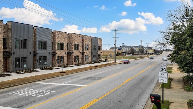 view of road with curbs and sidewalks