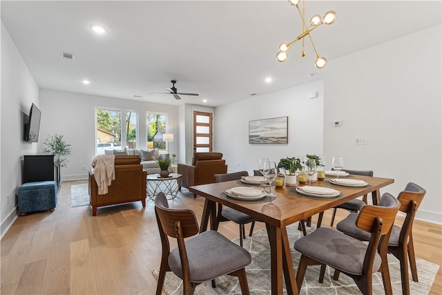 4124 W Olive St, Rogers, AR 72756 - dining area featuring recessed lighting, ceiling fan with notable chandelier, light wood finished floors, and visible vents