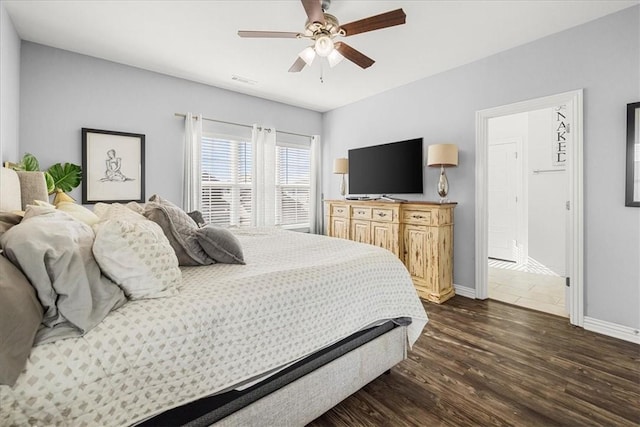 bedroom featuring dark hardwood / wood-style floors and ceiling fan