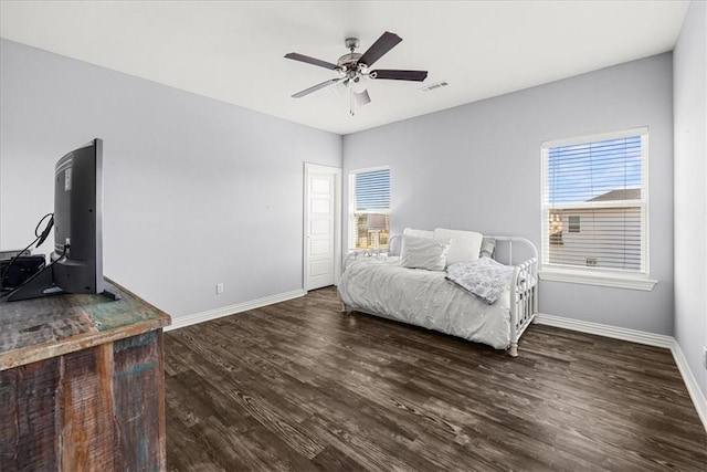 bedroom featuring ceiling fan and dark hardwood / wood-style flooring