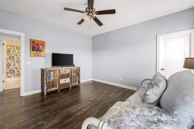 living room with dark hardwood / wood-style floors and ceiling fan