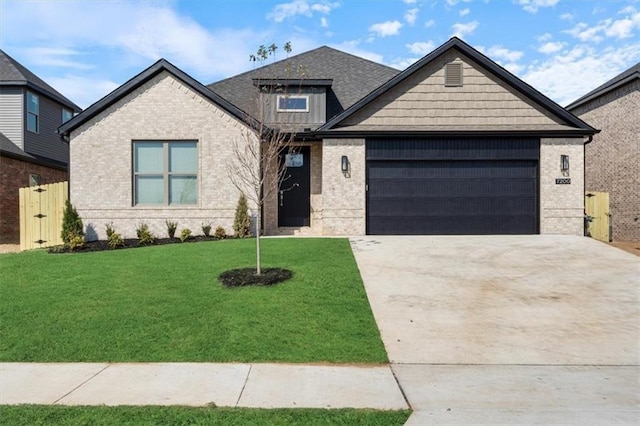 view of front of house with a garage and a front yard