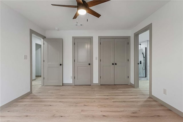 unfurnished bedroom with ceiling fan and light hardwood / wood-style flooring