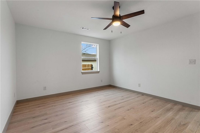 spare room with ceiling fan and light hardwood / wood-style floors