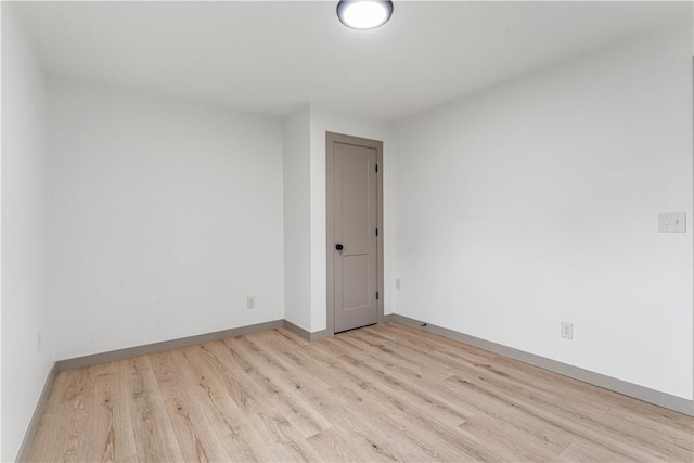 unfurnished room featuring light hardwood / wood-style flooring