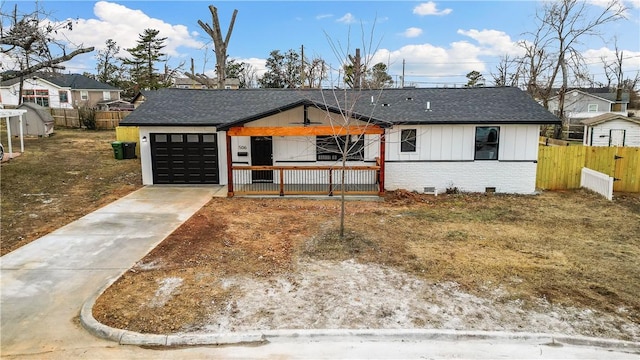 view of front of house with a garage and covered porch