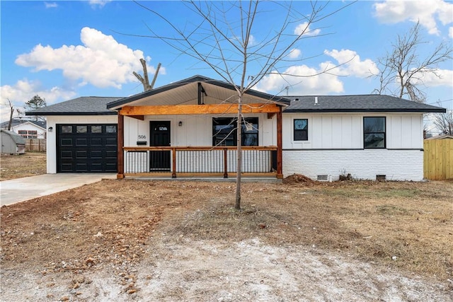 view of front of home featuring a garage and a porch