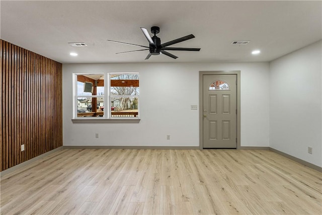 spare room with ceiling fan and light hardwood / wood-style flooring