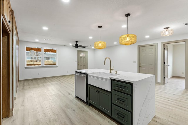 kitchen with sink, hanging light fixtures, light stone counters, a center island with sink, and stainless steel dishwasher