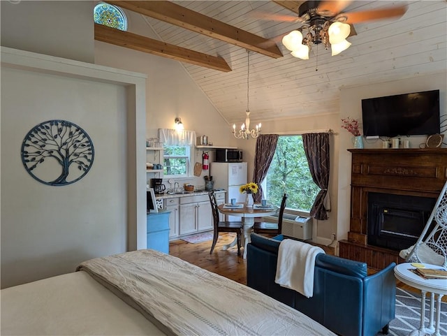 bedroom featuring vaulted ceiling with beams, sink, white refrigerator, wood ceiling, and an inviting chandelier