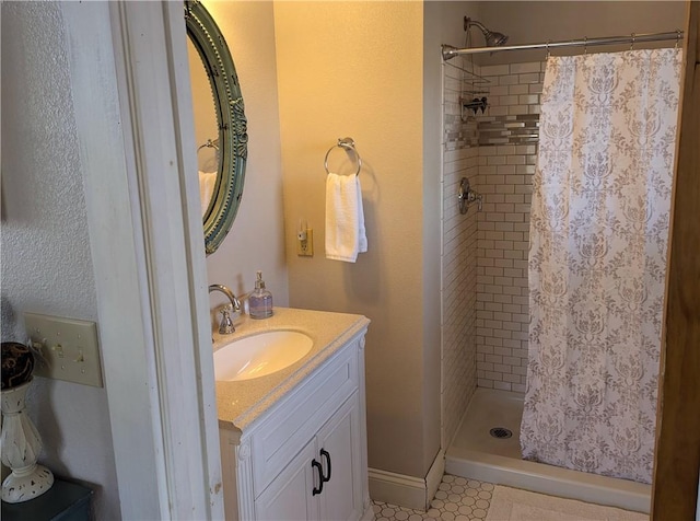 bathroom featuring vanity and curtained shower