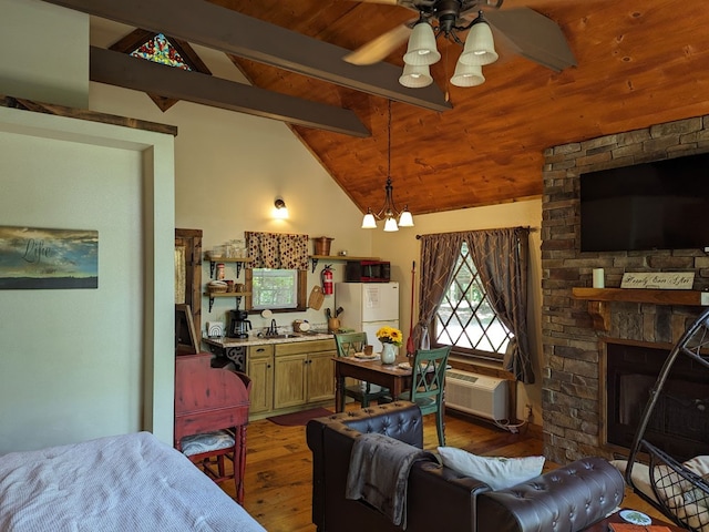 living room with wood ceiling, ceiling fan with notable chandelier, vaulted ceiling with beams, dark hardwood / wood-style floors, and a stone fireplace