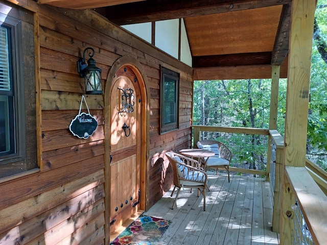 wooden deck featuring covered porch