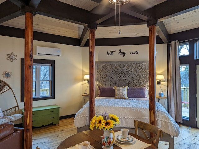 bedroom featuring beamed ceiling, light wood-type flooring, and a wall unit AC