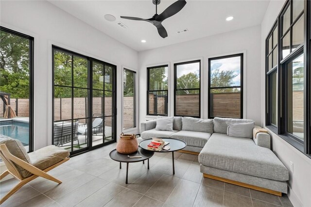 sunroom with ceiling fan