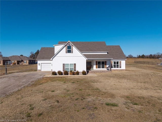 view of front of home with a garage and a front yard