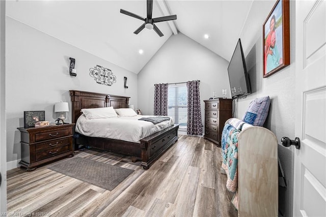 bedroom featuring light wood finished floors, recessed lighting, ceiling fan, high vaulted ceiling, and beamed ceiling