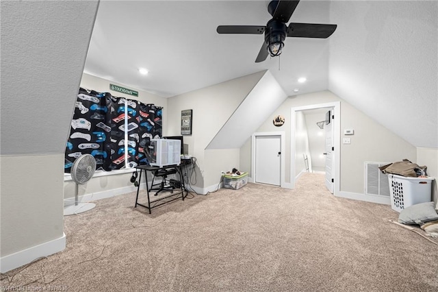 workout area featuring carpet floors, baseboards, visible vents, and vaulted ceiling