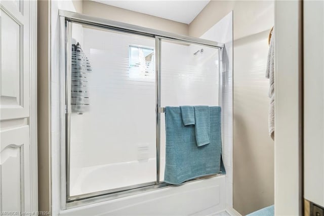 full bath with shower / bath combination with glass door