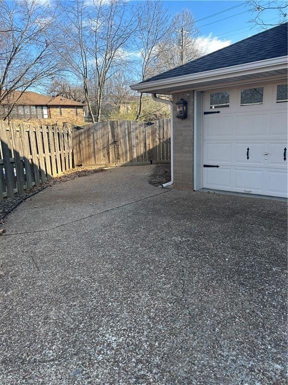 garage featuring fence