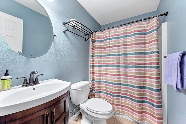 bathroom featuring a shower with curtain, vanity, toilet, and tile patterned flooring