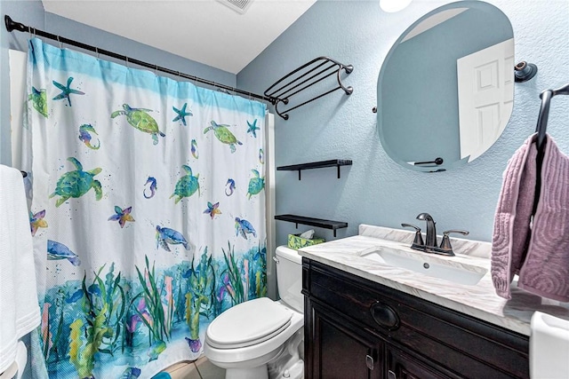 bathroom featuring a shower with curtain, vanity, and toilet