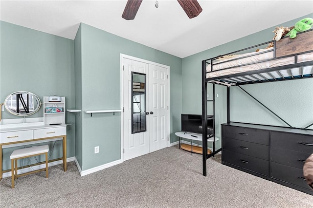 bedroom featuring carpet flooring, ceiling fan, and a closet