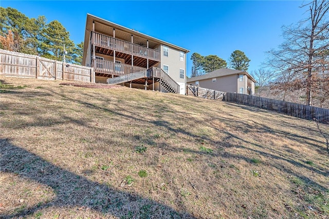 rear view of house with a yard