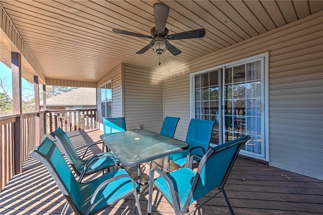 wooden terrace featuring ceiling fan