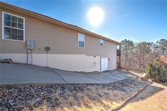 view of side of property featuring a patio