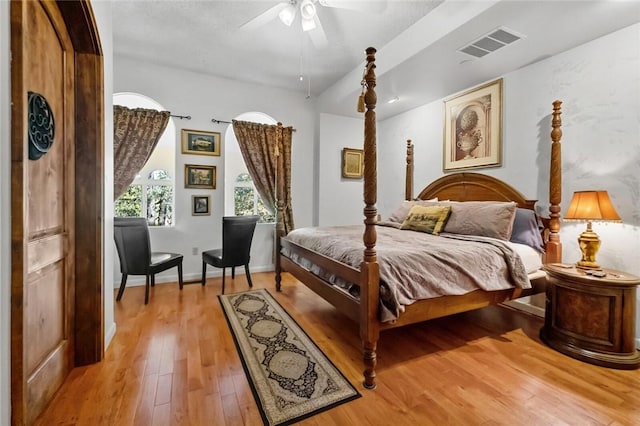 bedroom featuring light hardwood / wood-style floors and ceiling fan