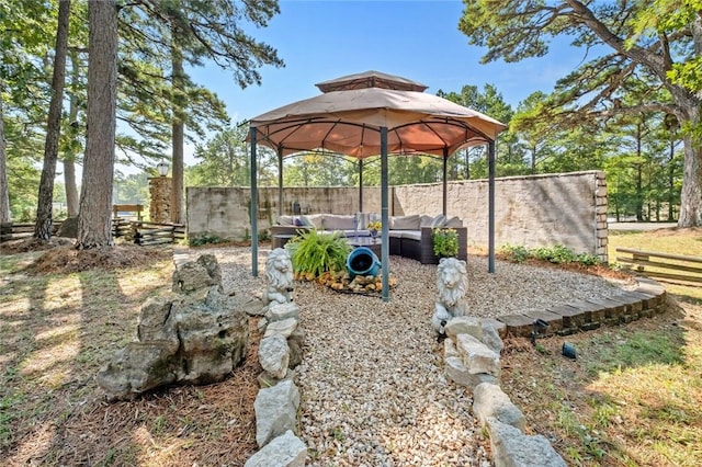 view of yard featuring a gazebo and outdoor lounge area