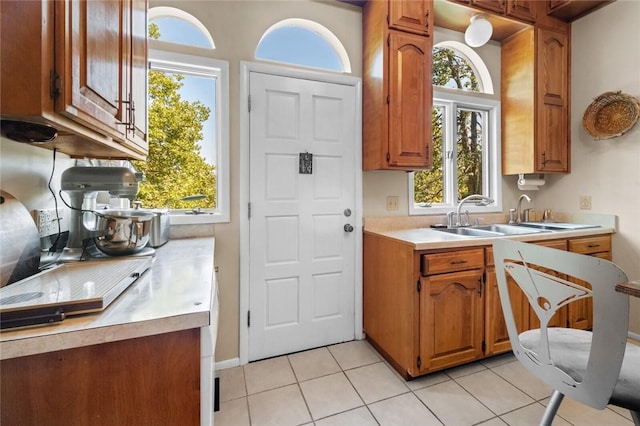 kitchen featuring sink and light tile patterned floors