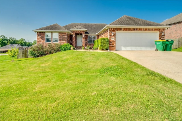 ranch-style house featuring a garage and a front yard