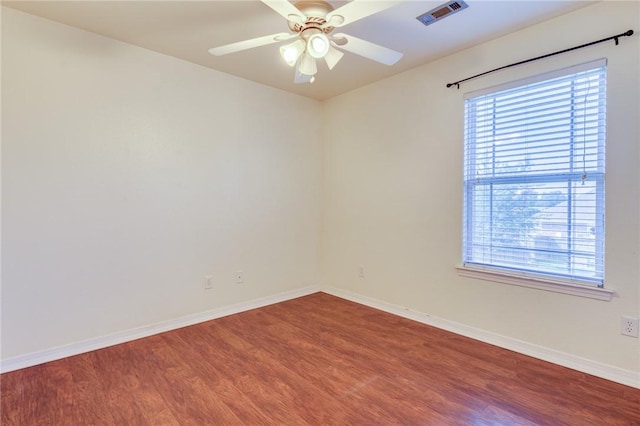 unfurnished room with ceiling fan and hardwood / wood-style floors