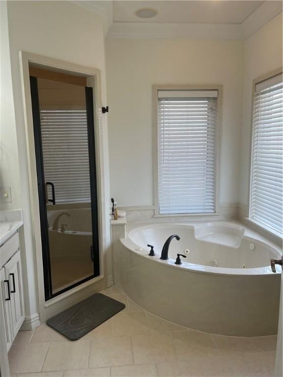 bathroom with ornamental molding, vanity, plus walk in shower, and tile patterned flooring