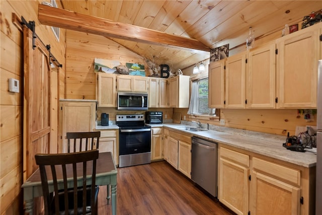 kitchen featuring light brown cabinetry, wooden ceiling, dark hardwood / wood-style flooring, stainless steel appliances, and a barn door