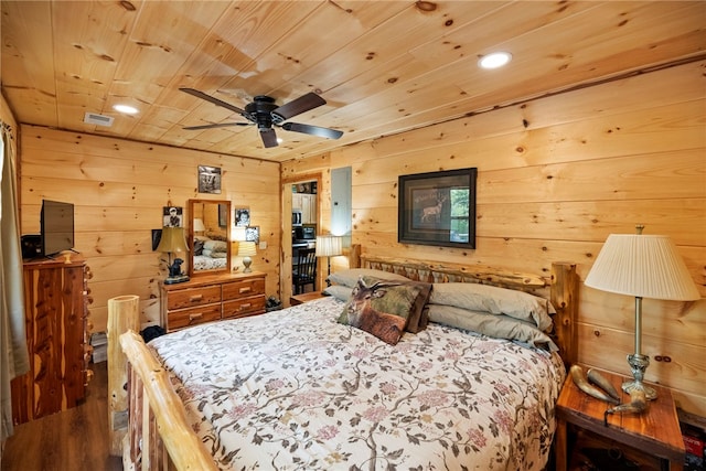 bedroom with hardwood / wood-style floors, wood ceiling, and wood walls