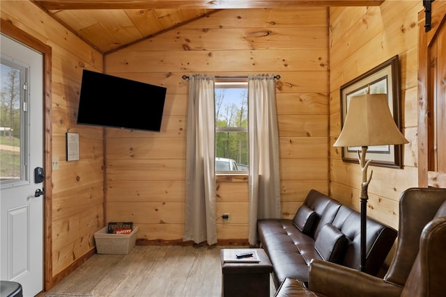 interior space featuring hardwood / wood-style flooring, wooden ceiling, vaulted ceiling, and wood walls