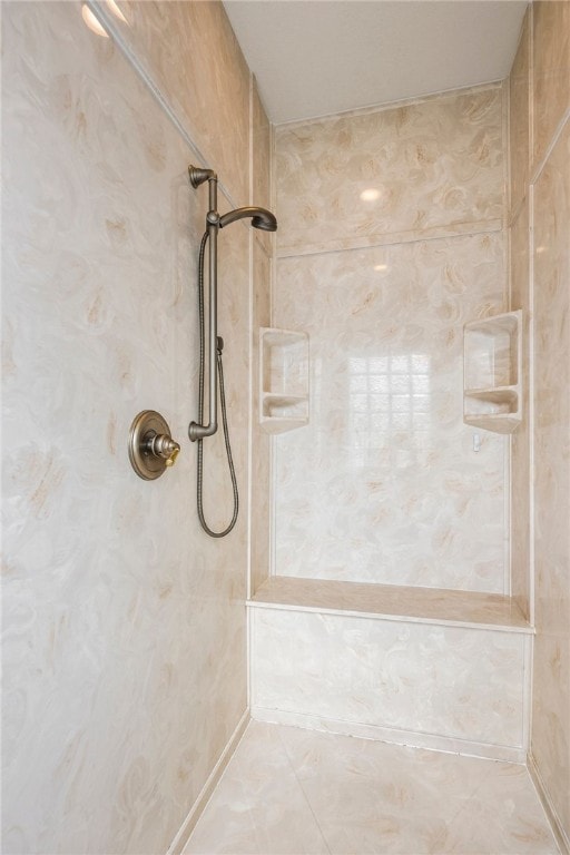 bathroom with tiled shower