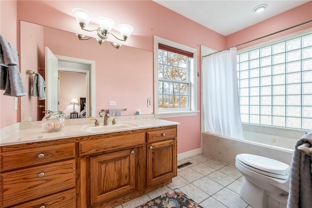 full bathroom featuring vanity, tile patterned floors, shower / bath combo with shower curtain, and toilet