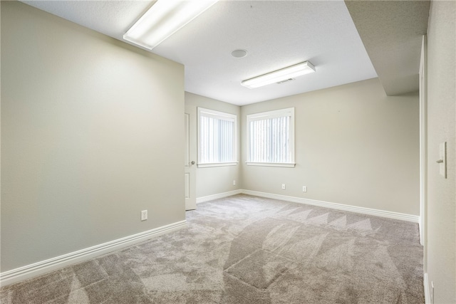 empty room featuring light colored carpet